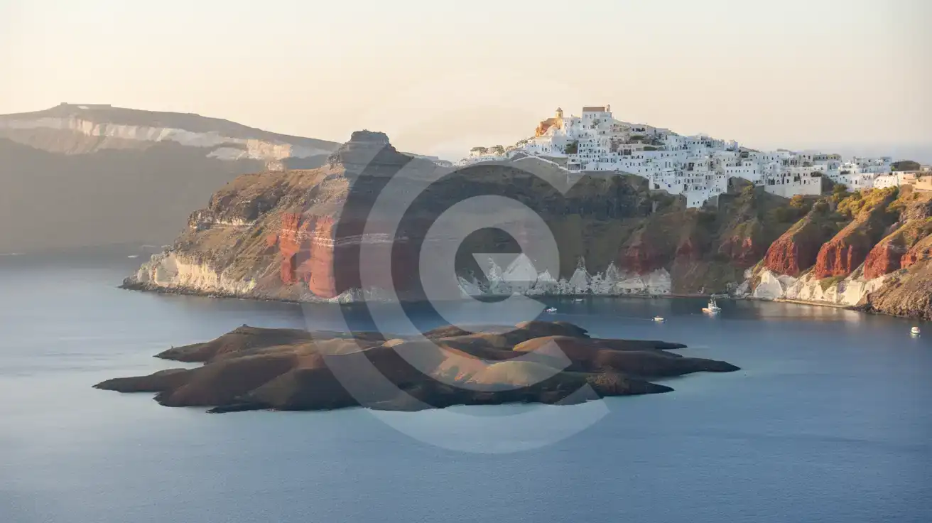 Santorini caldera at sunset with whitewashed cliff-top villages and volcanic islands in the crater below