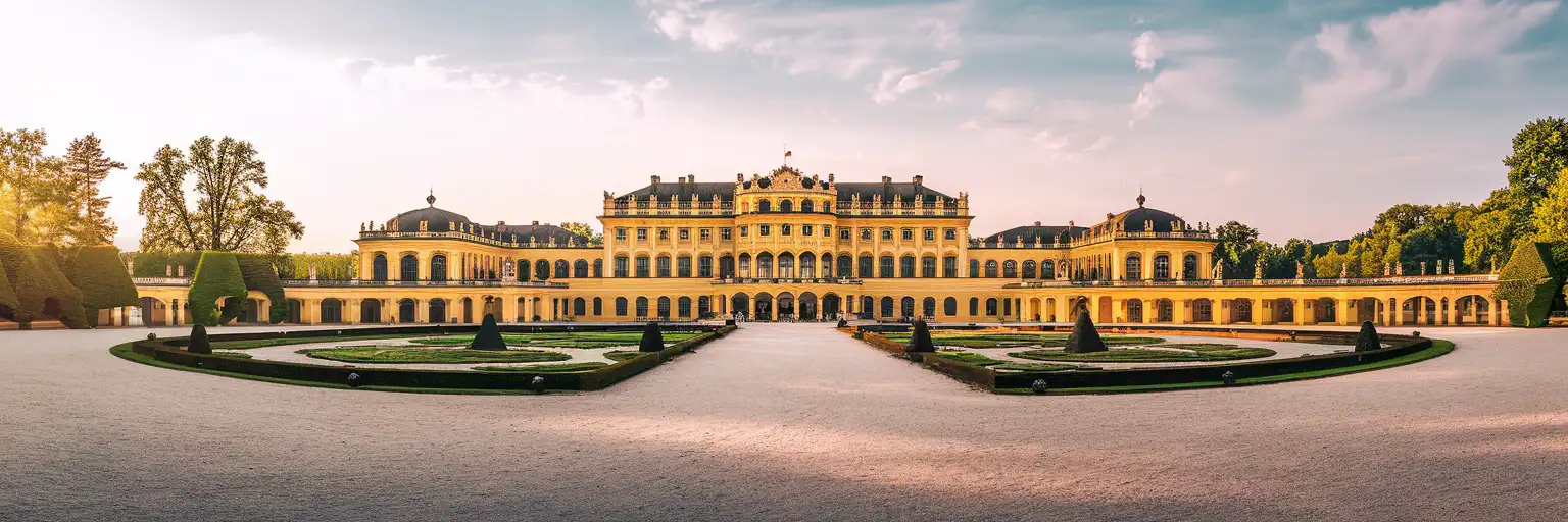 Schönbrunn Palace in Vienna with baroque gardens and Vienna Woods in golden-hour light