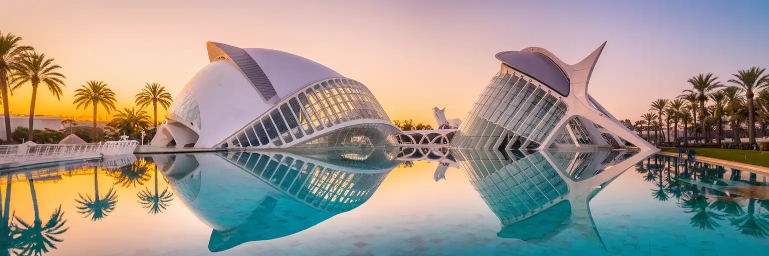 City of Arts and Sciences complex in Valencia at golden hour with futuristic white architecture reflected in surrounding pools