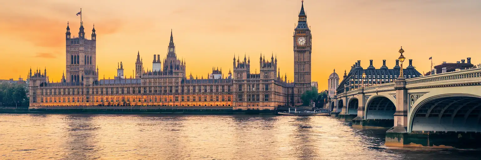 Big Ben and the Houses of Parliament along the River Thames at golden hour in London