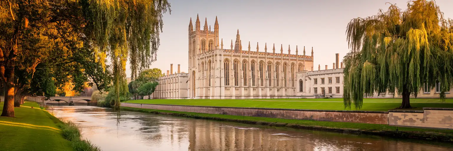 King's College Chapel in Cambridge at golden hour with the River Cam reflecting the historic Gothic architecture