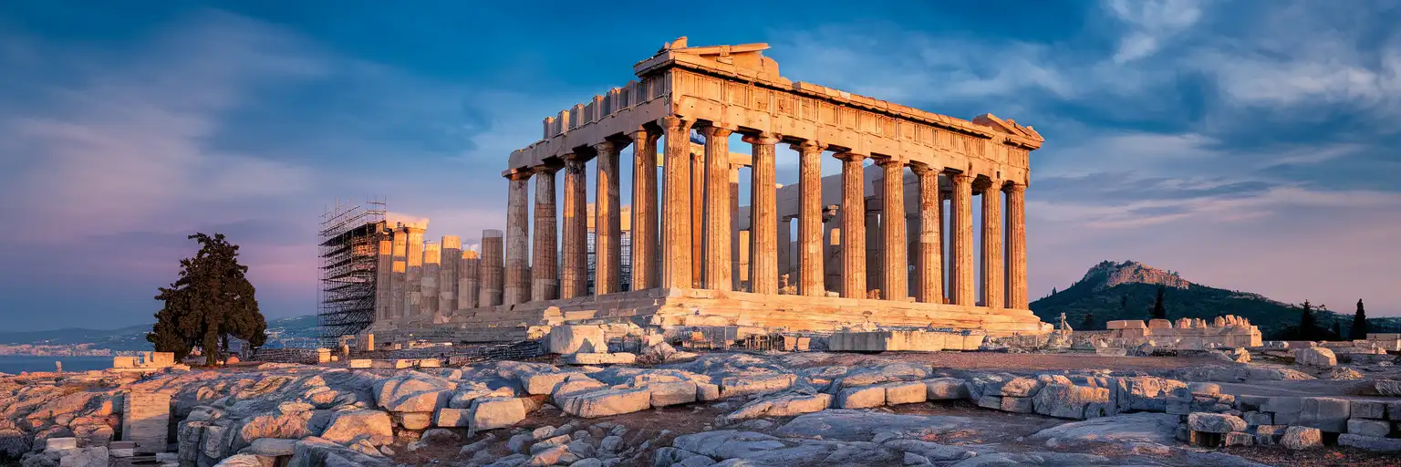 The Parthenon's western facade with Doric columns rising against the Athenian sky at golden hour