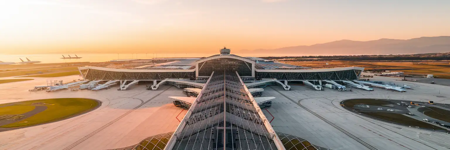 Exterior view of Thessaloniki Airport Makedonia terminal at golden hour in Thessaloniki, Greece