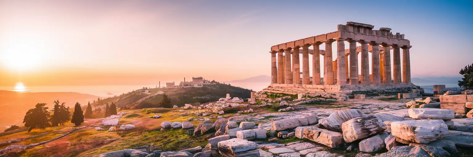Wide golden-hour view of the Temple of Apollo at the Acropolis of Rhodes on Monte Smith above Rhodes city