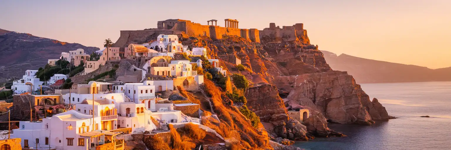 Wide exterior view of the Acropolis of Lindos above the whitewashed village and coastline in Rhodes, Greece