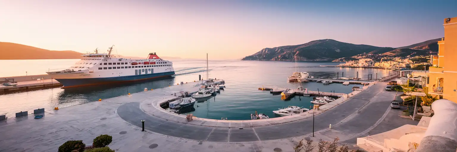 Wide golden-hour view of Zakynthos Port with the main ferry quay and waterfront of Zakynthos Town