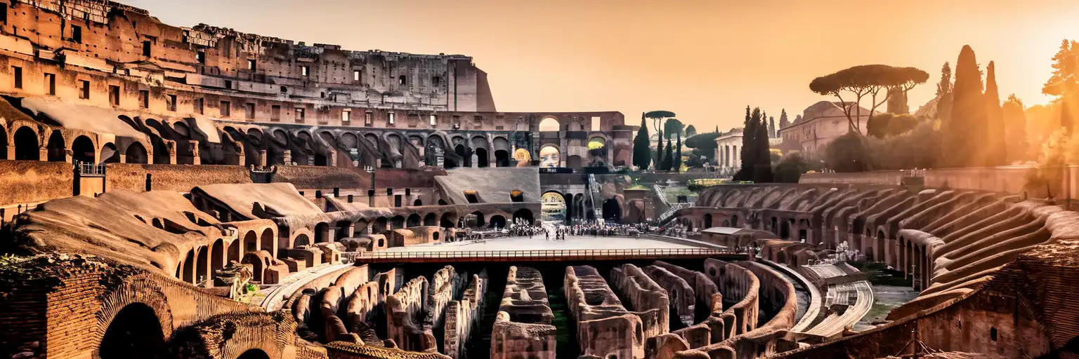 The Colosseum in Rome bathed in golden-hour light with the Roman Forum visible in the background