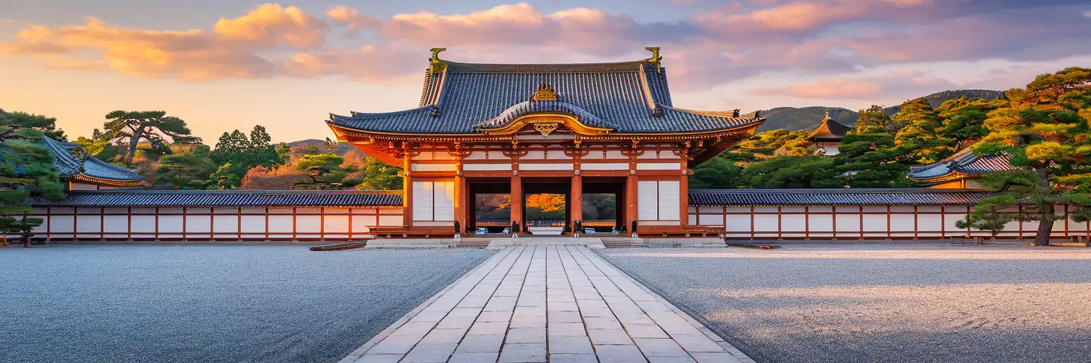 Kyoto Imperial Palace Shishinden Hall exterior viewed across the white gravel courtyard at golden hour