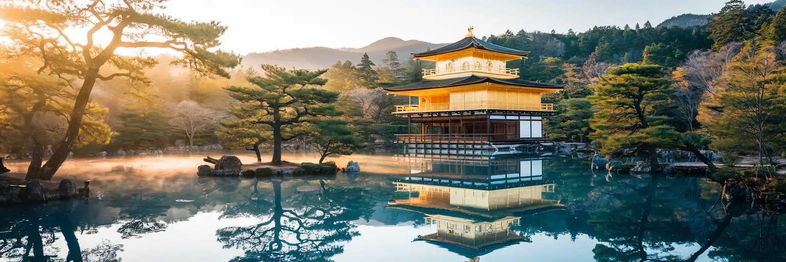 Kinkaku-ji Golden Pavilion reflected in its mirror pond at golden hour in Kyoto, Japan