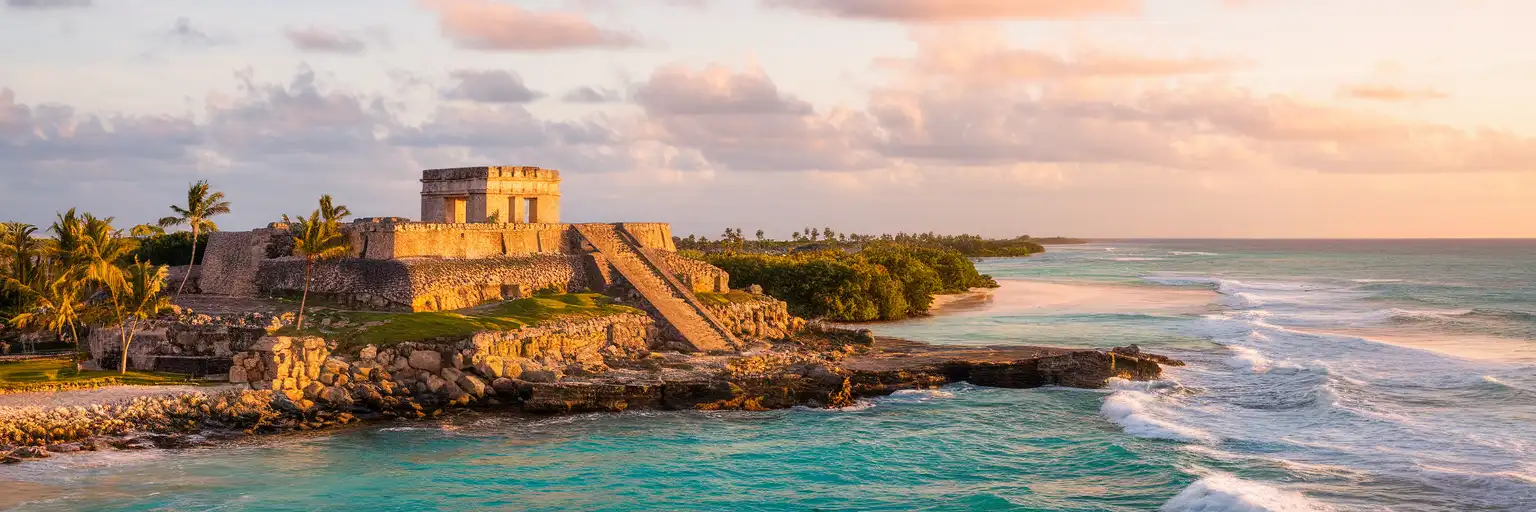 El Castillo at Tulum Archaeological Zone above the Caribbean Sea at golden hour