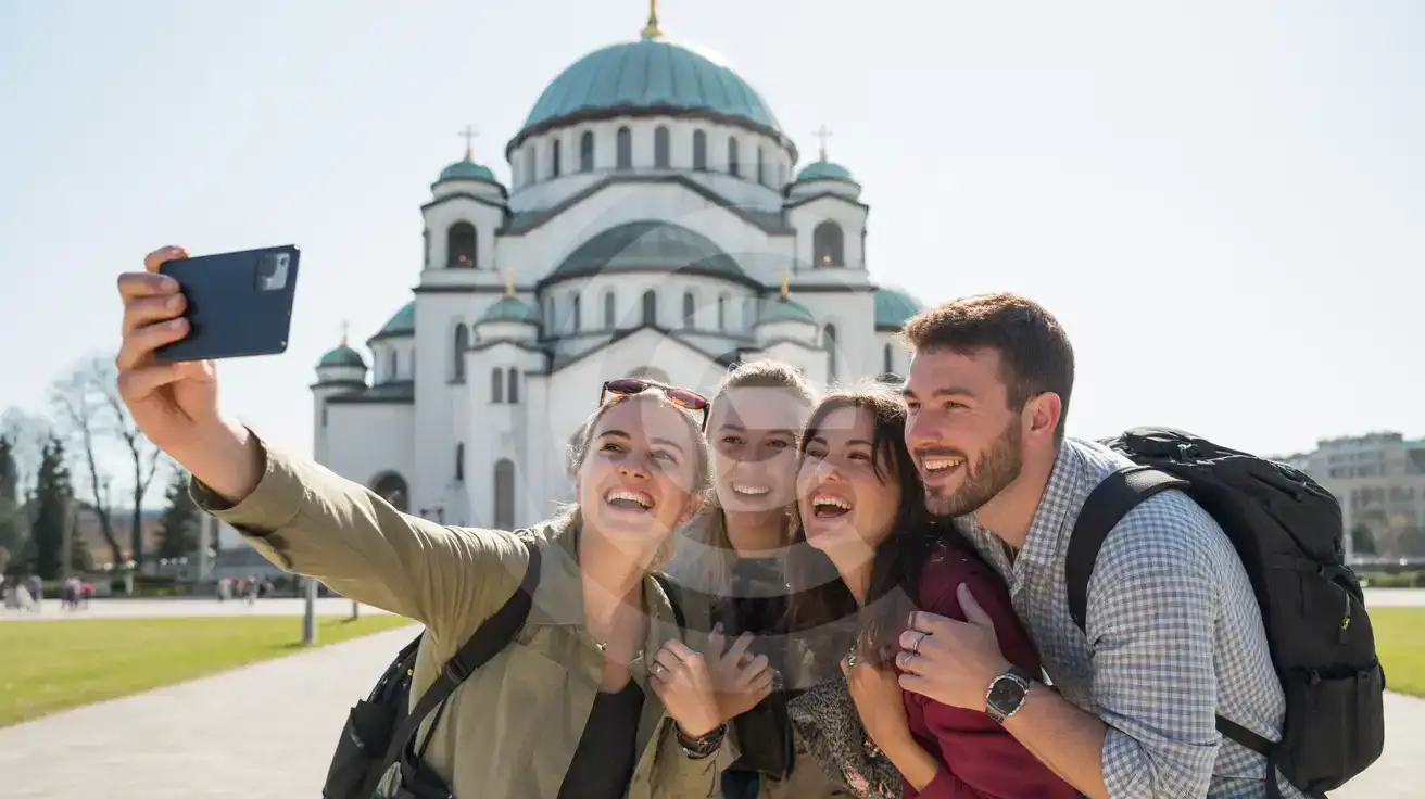 Three friends taking a group selfie in front of the Church of Saint Sava in Belgrade on a bright clear day