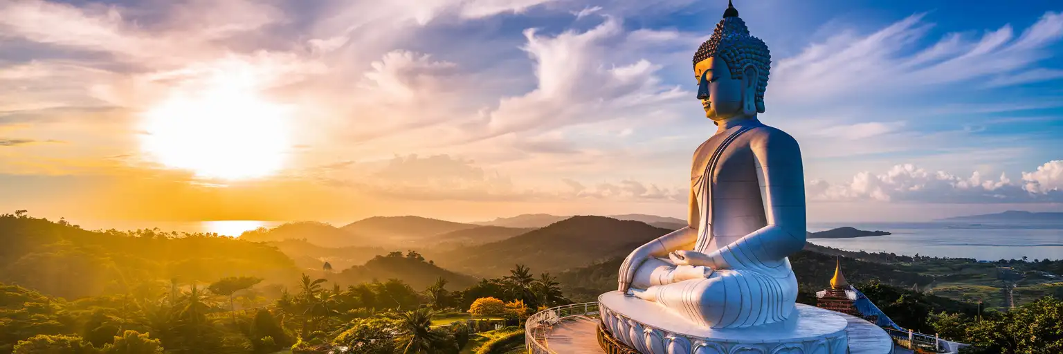 Big Buddha statue on Nakkerd Hill in Phuket at golden hour with Andaman Sea views
