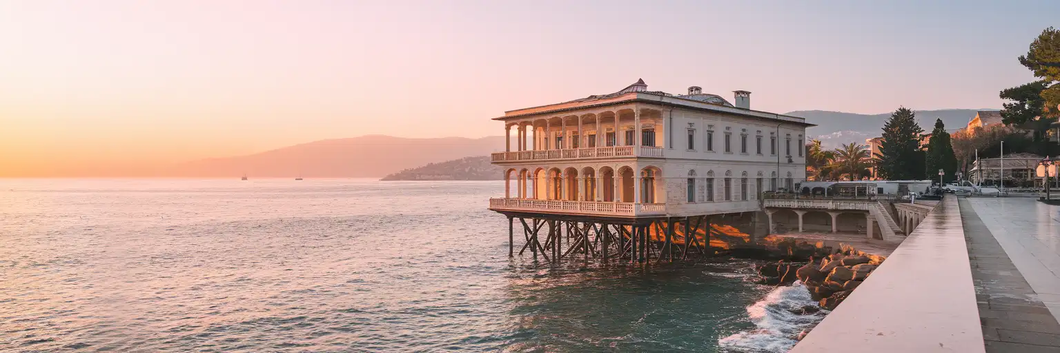 Exterior view of Florya Atatürk Marine Mansion extending over the Marmara Sea at sunset in Istanbul