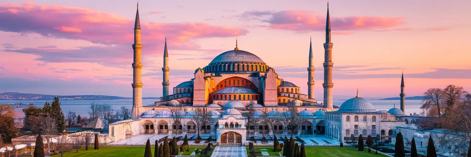 Hagia Sophia Grand Mosque at golden hour viewed from Sultanahmet Square in Istanbul, Turkey