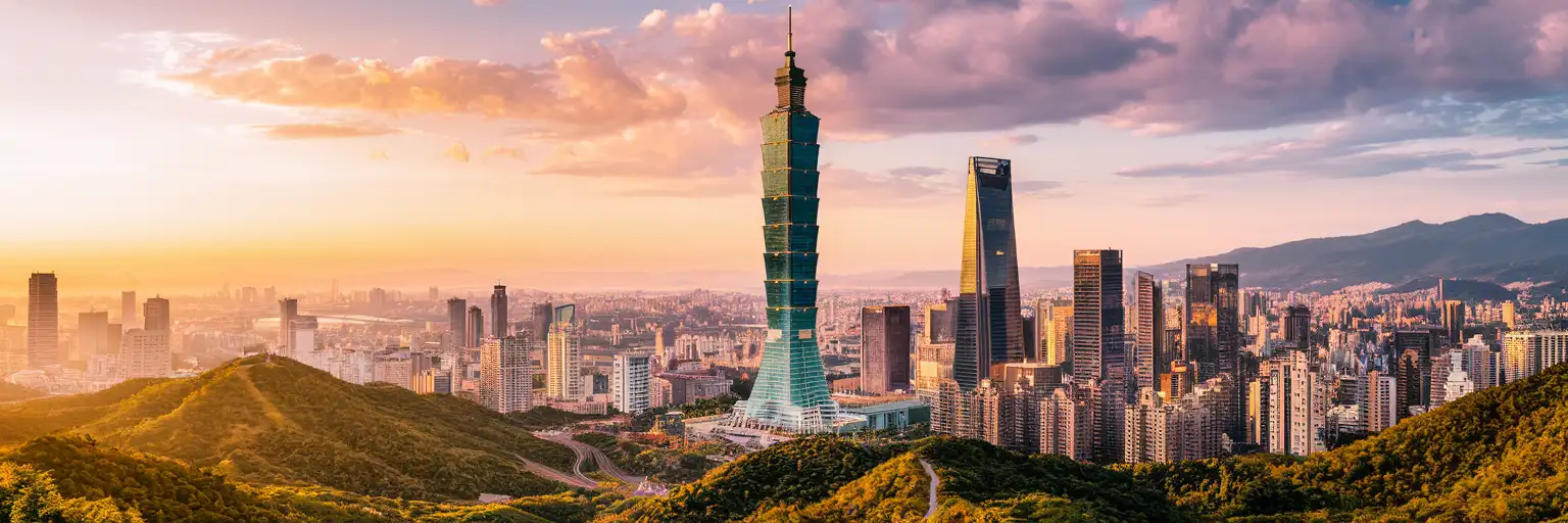 Taipei 101 skyscraper rising above the Xinyi District skyline at golden hour with Elephant Mountain ridgeline in the background