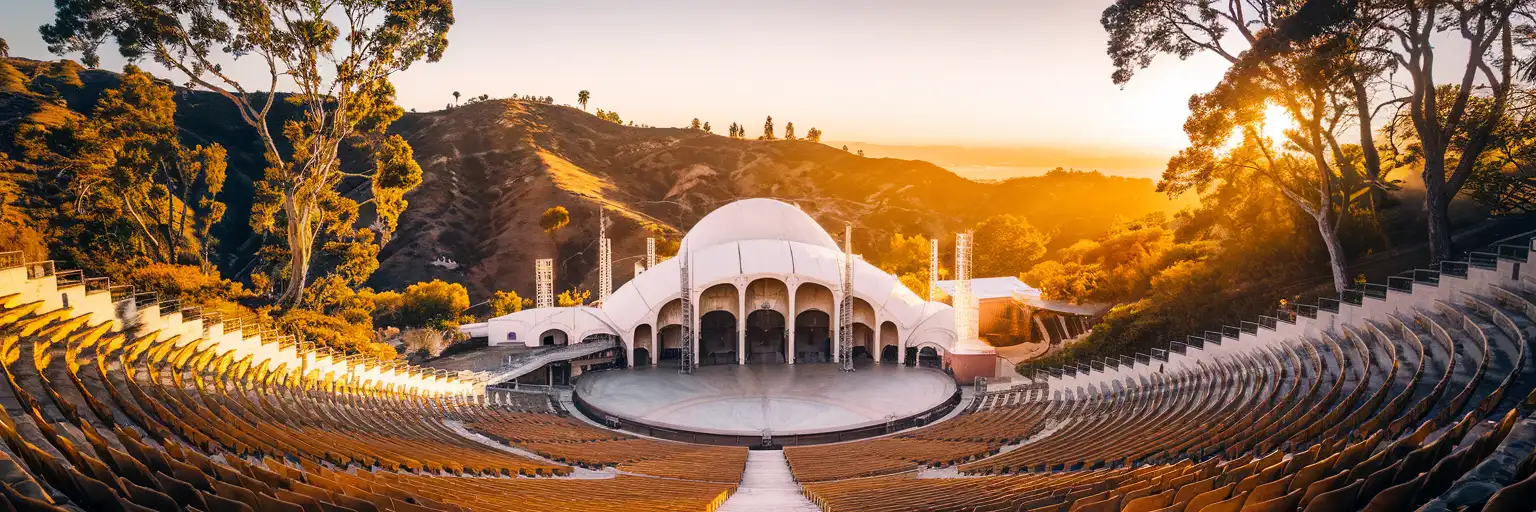 Hollywood Bowl amphitheater exterior with iconic white band shell arches against Hollywood Hills at golden hour